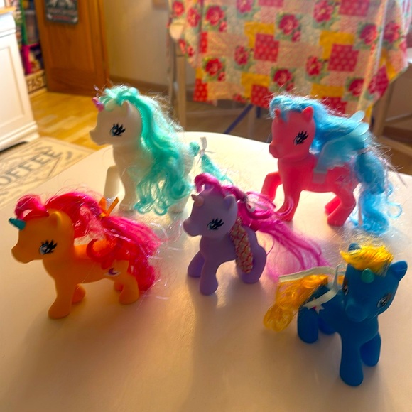 Five unicorn my ponies with colorful hair